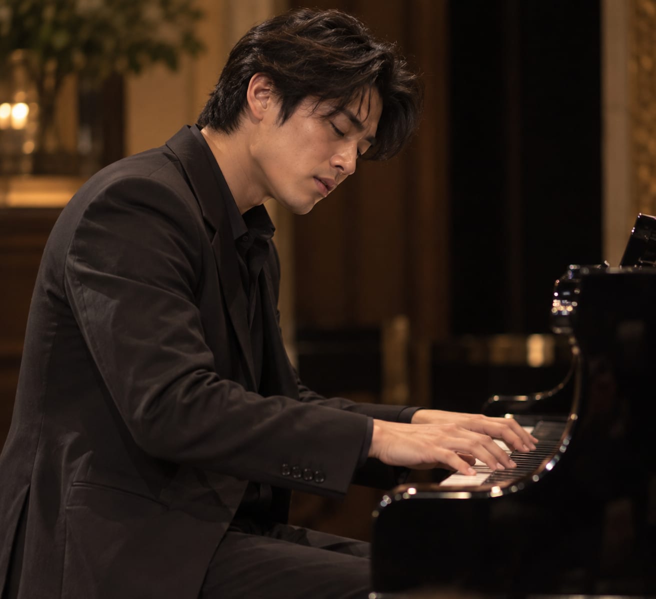 Concert pianist performing at a grand piano